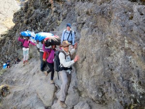 Our porters stuck behind me while I navigate the "kissing rock"; staying in kissing range to avoid sliding into oblivion.
