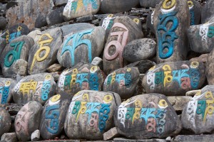 Mani wall comprised of mani stones. A lot of effort has gone into carving these prayers
